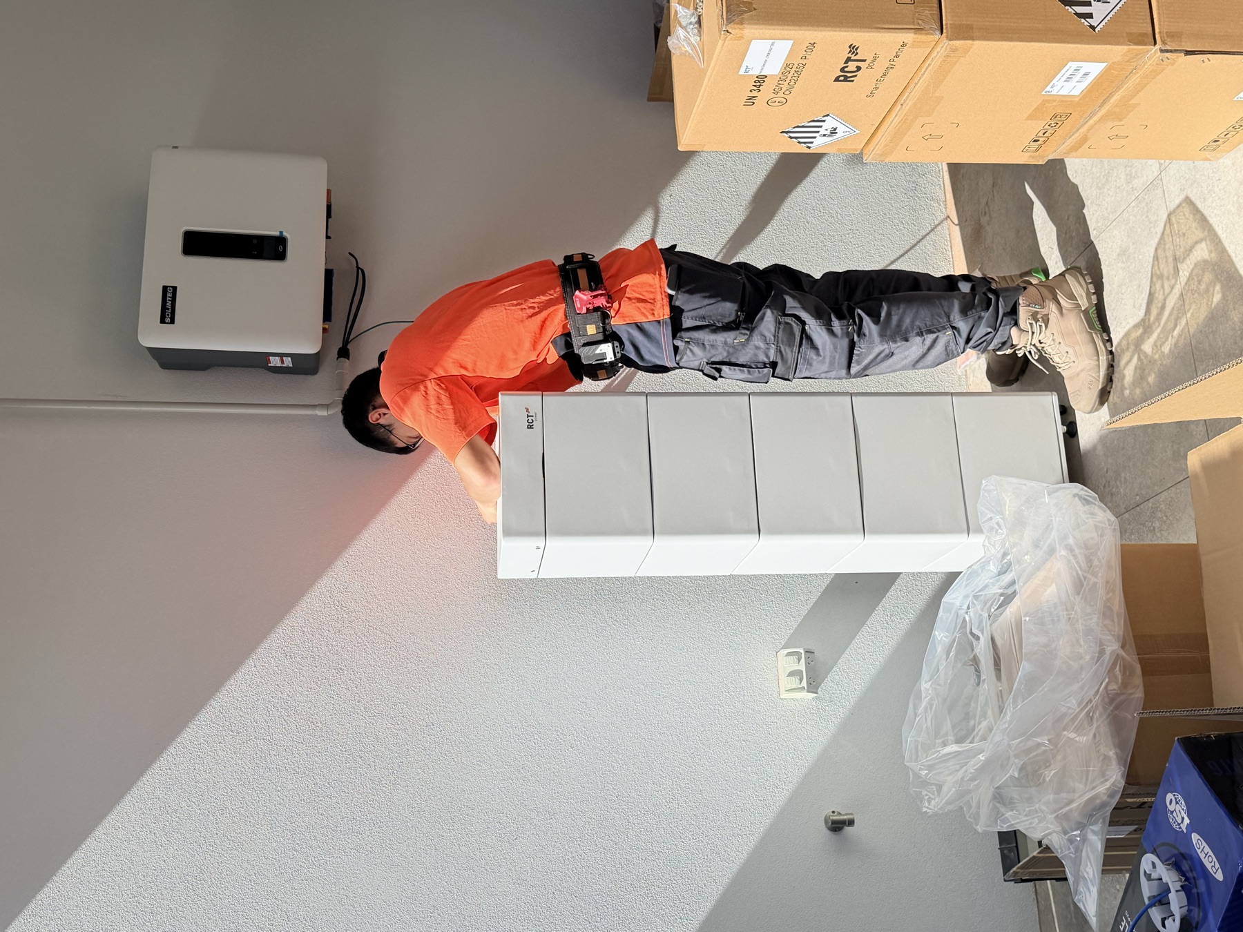 Technician stacking the RCT Power battery modules